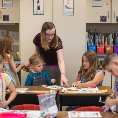 A picture of an individual teaching school-age children